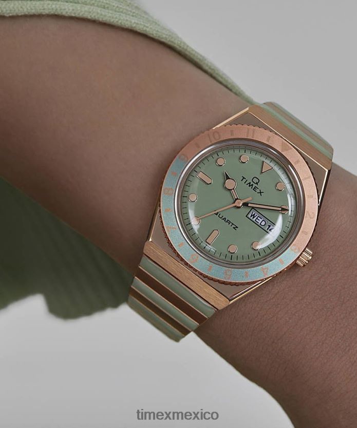 relojes | Q Timex reloj malibu de 36 mm con correa de expansión de acero inoxidable mujer P08BBP338 tono oro rosa/verde